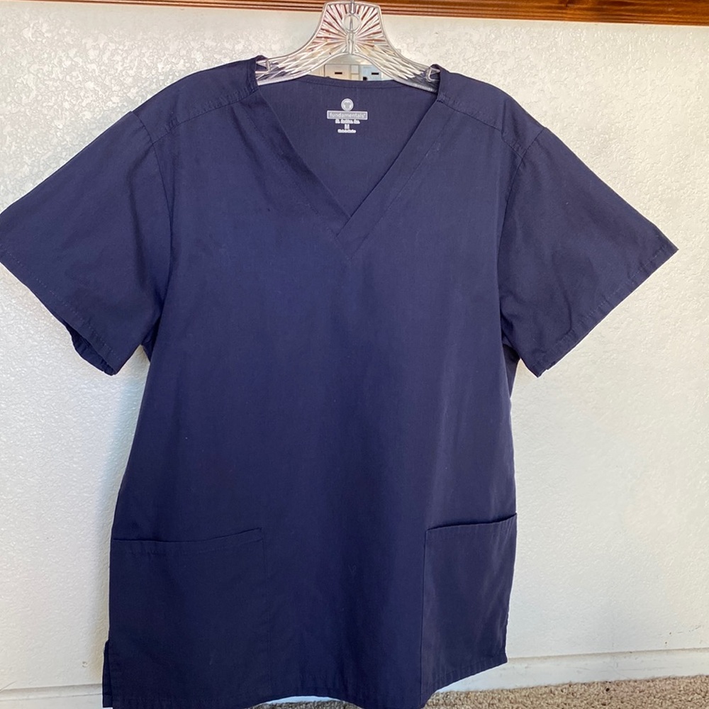 Navy blue scrub top by Fundamentals. V neck & front pockets. Measurements noted.